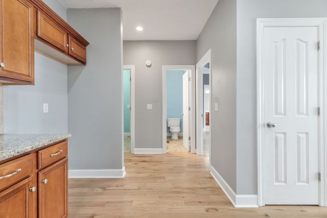 Kitchen View Toward Primary Bedroom, Laundry Room, Spare Bathroom | Image 12