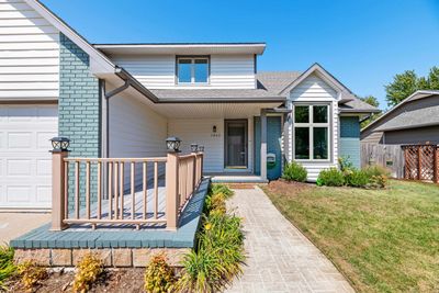 View of front of house featuring a garage and a front lawn | Image 3