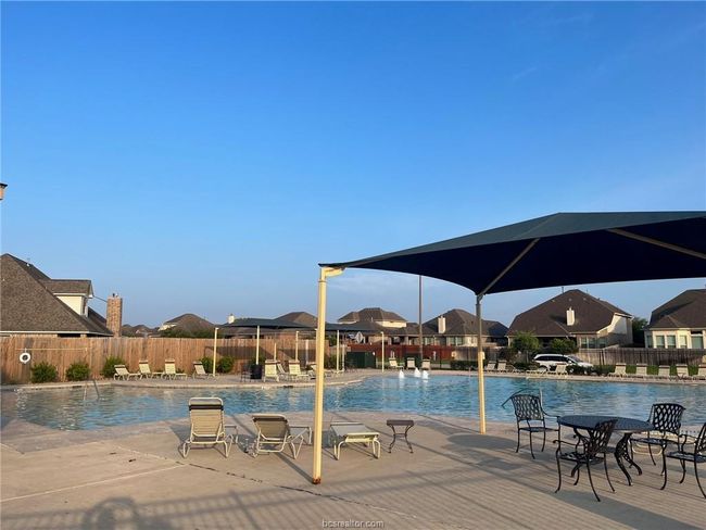 Community pool featuring a patio area and fence | Image 24