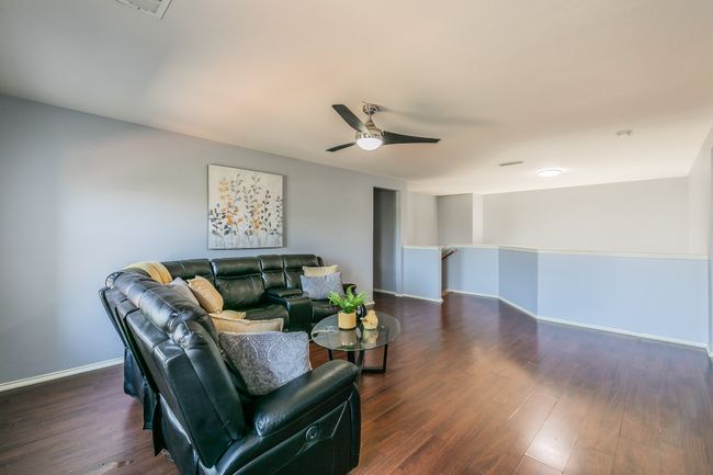 Living area with ceiling fan and dark wood-style flooring | Image 18