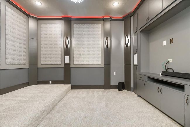 With custom, upgraded lighting and sound, enjoy the ultimate movie experience in this sound-proof movie theater. | Image 6