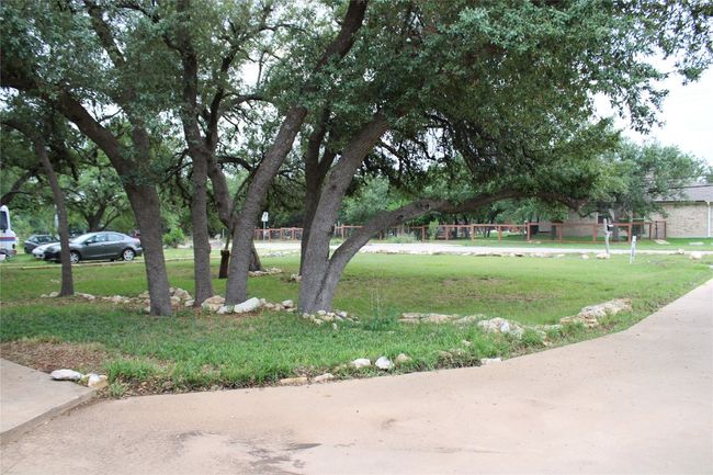 Surrounding community with a yard | Image 27