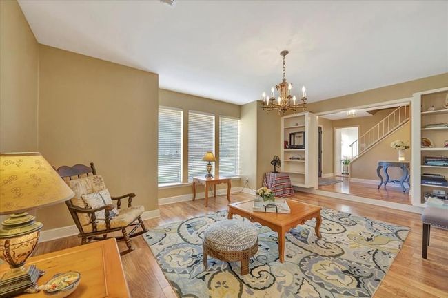 Here is another view of the den offering lots of natural light and built in bookcases. | Image 28