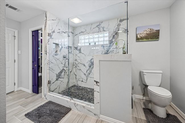 Custom shower with great lighting, creating a bright and open space for relaxation. | Image 18
