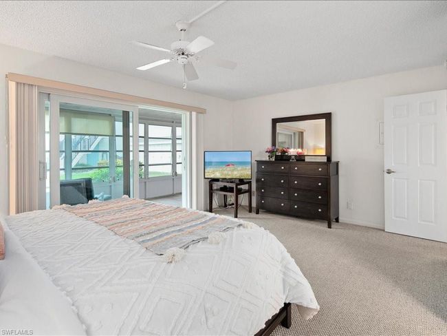 Carpeted bedroom featuring access to exterior, a ceiling fan | Image 6