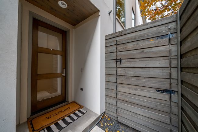 Entrance to property featuring stucco siding | Image 7