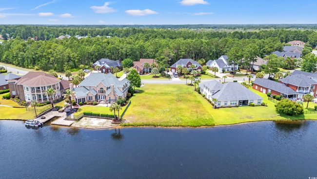 Aerial perspective of suburban area with a nearby body of water | Image 5