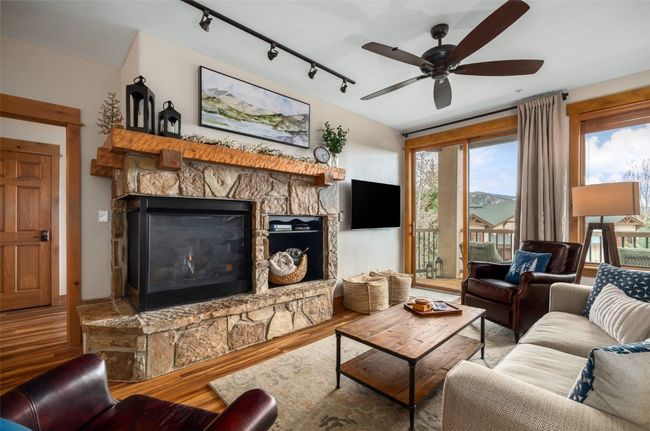 Living room with gas fireplace, and access to patio | Image 4
