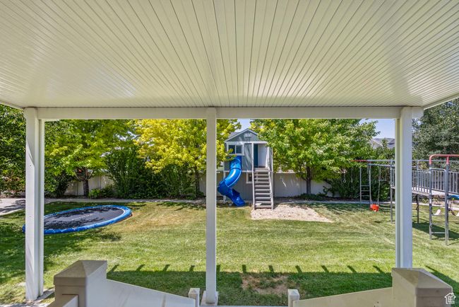 Fenced backyard with a playground | Image 33