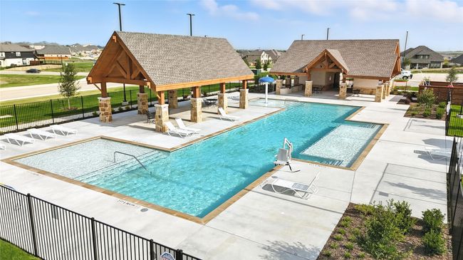 Community pool with a gazebo, a residential view, a patio, and a storage structure | Image 26