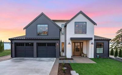 Modern Farmhosue with Brick and Lap Siding, Black Windows and 2 Car garage | Image 1