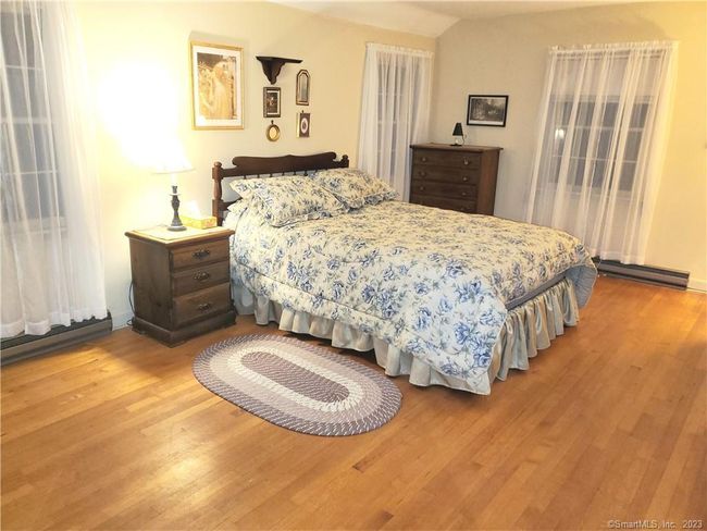 Primary bedroom upper level 18 x 11.7. Hardwood floors, lots of natural light. 2 closets. | Image 26