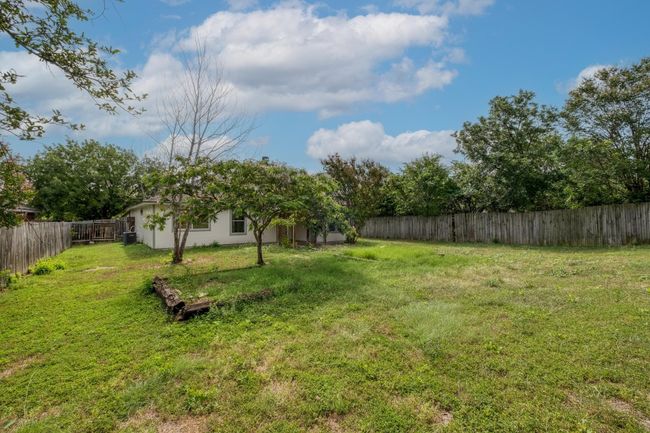 View of fenced backyard | Image 24