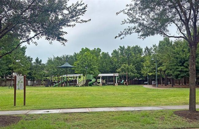 The home is a brisk short walk from the well kept quiet community park. | Image 36