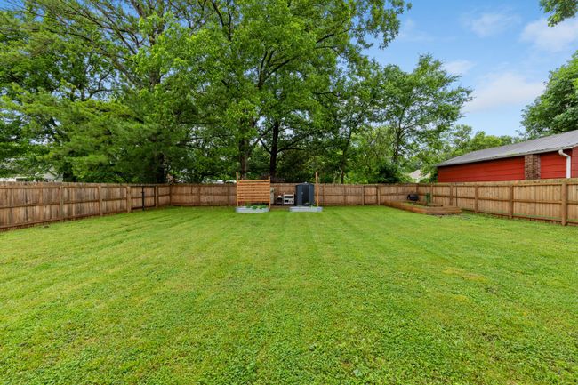 The spacious backyard has been heavily improved over the past couple years to make a nice place to play, sit, garden, whatever your heart desires. | Image 5