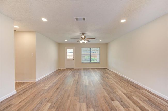 The family room is quite large and can hold large furniture and has 2 walls for a large format TV too! | Image 7