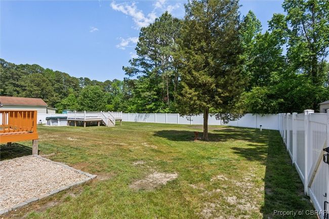 View of yard featuring a deck | Image 30