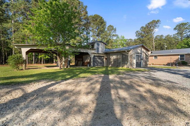 View of front facade featuring a front lawn and driveway | Image 6