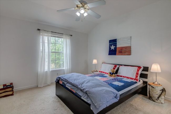 2nd bedroom upstairs has a view of the golf course. | Image 17