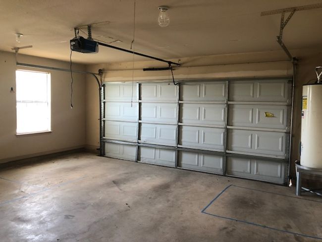 Oversized garage with water heater and a garage door opener | Image 14