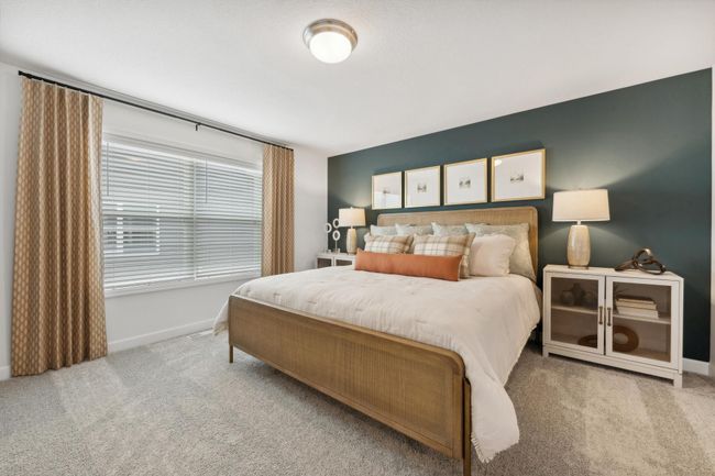 (Photo of decorated model, actual home's finishes may vary slightly) Extremely spacious and elegant, this private owner's suite connects to a large en-suite bath providing a great oasis to relax in your own private space. | Image 8