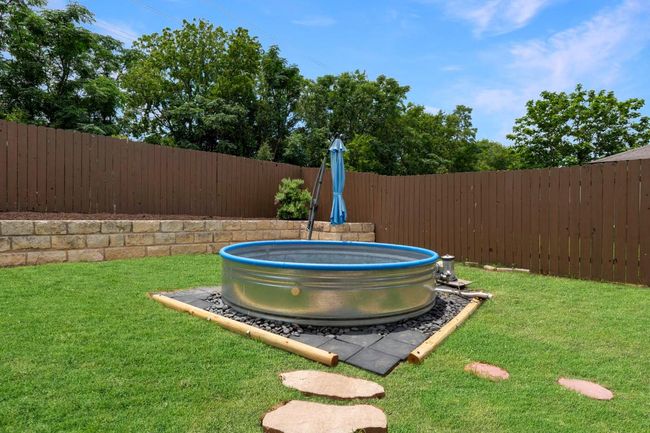 Fenced backyard with a pool | Image 31