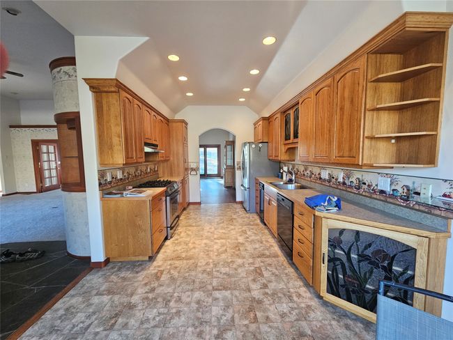 The dining area is just off the living room and kitchen. | Image 15