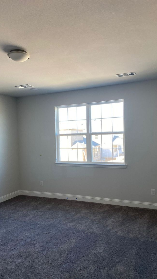 Spare room with dark colored carpet and baseboards | Image 10
