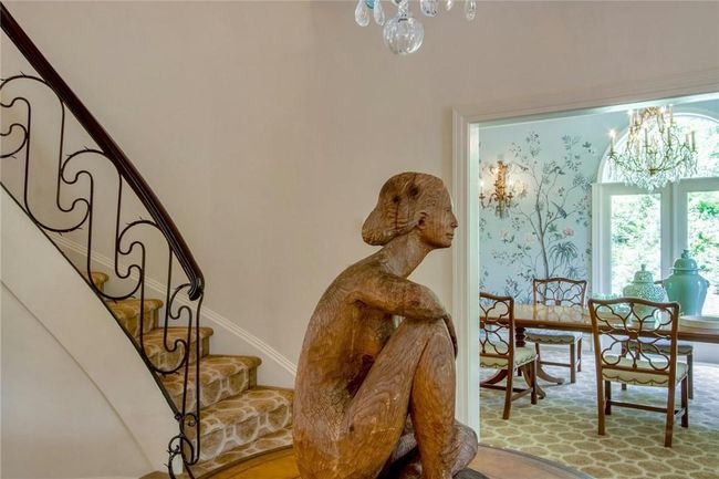 Stairs with a wealth of natural light and a chandelier | Image 5