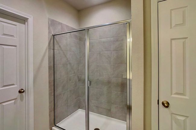 Bathroom featuring a shower stall | Image 13
