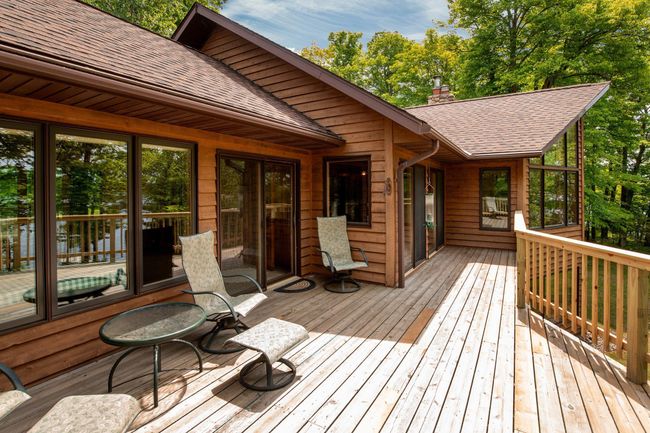 Enjoy time with friends and family on this lake side deck! | Image 39