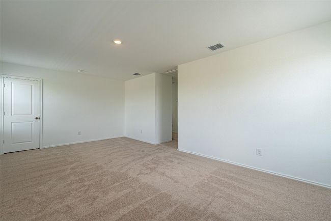 Empty room with light carpet, baseboards, and recessed lighting | Image 14
