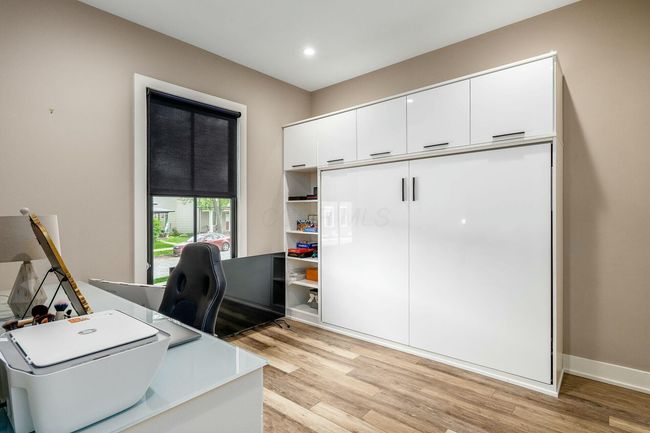 1st floor guest bedroom with murphy bed and office | Image 19