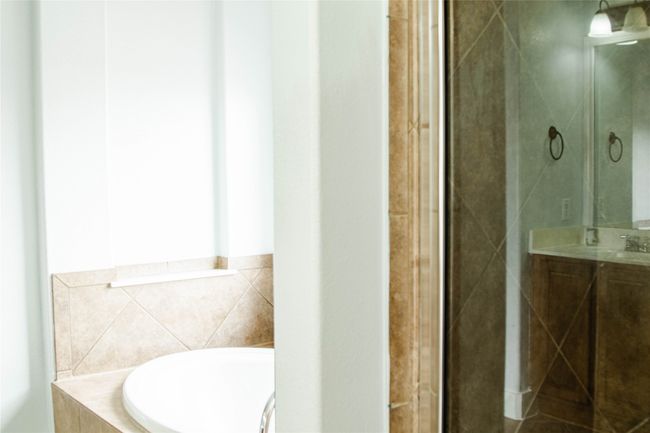 Bathroom with vanity and a garden tub | Image 24