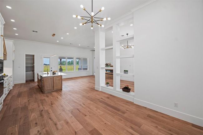 Elegant dining area with abundant natural light, open layout, and modern fixtures—perfect for hosting and family gatherings. | Image 12
