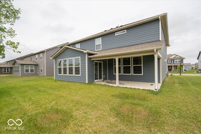 rear view of house with a patio and a lawn | Image 24