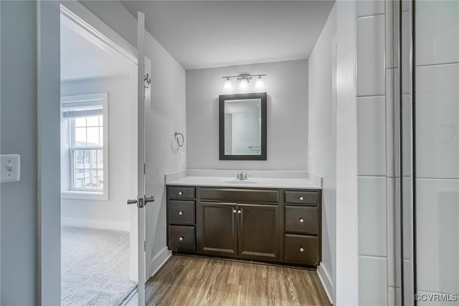 Bathroom with vanity and wood finished floors | Image 24