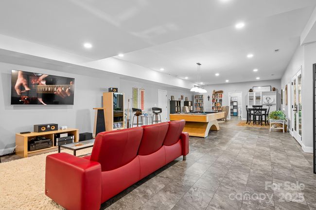 Lower level/basement finished space with tons of options for entertainment, gym, office space etc. | Image 25