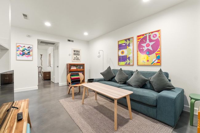 Living room with concrete floors and recessed lighting | Image 4