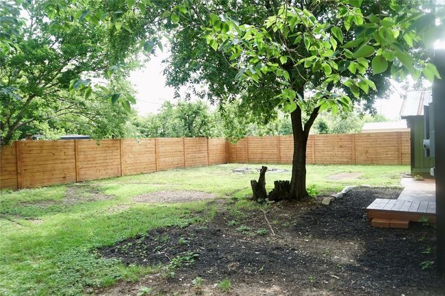View of fenced backyard | Image 23