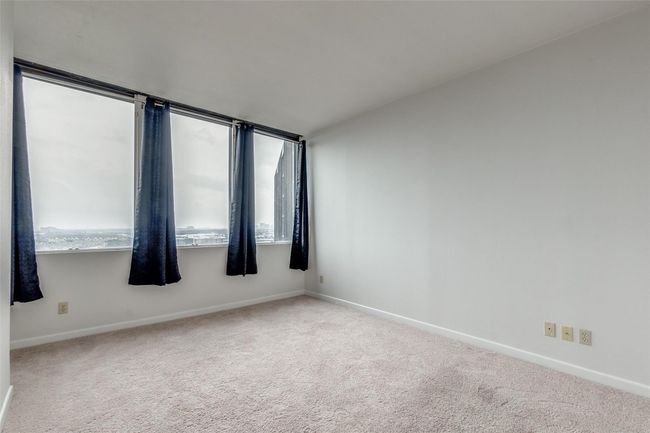 Spare room featuring carpet flooring and baseboards | Image 7