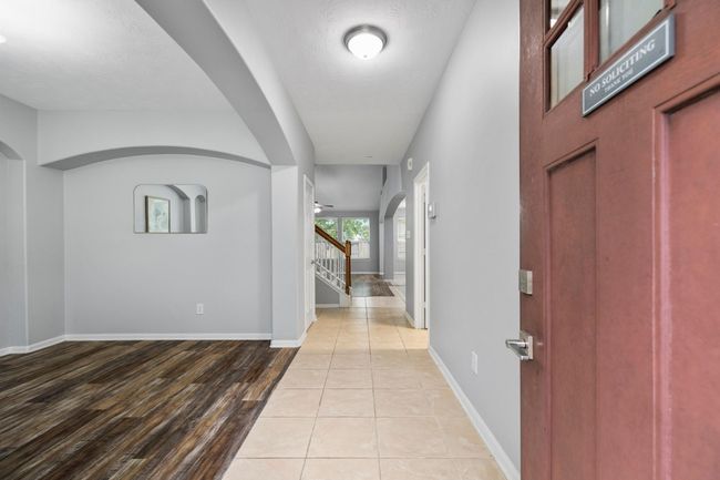 Step inside to find soaring ceilings, arched accents, and sightlines that draw you straight into the heart of the home. | Image 4