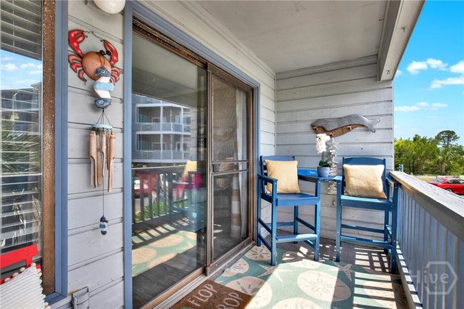 Balcony with Sunset & Partial Water Views! | Image 21