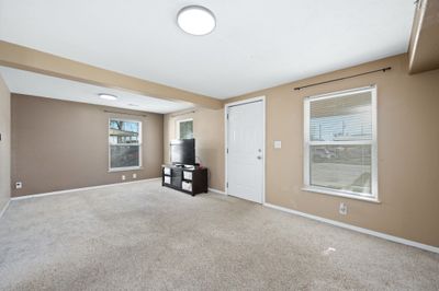 Unfurnished living room featuring carpet | Image 3