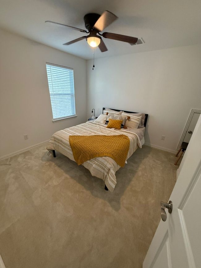 Carpeted bedroom with baseboards and ceiling fan | Image 12