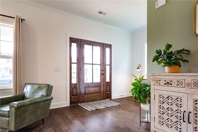 Lovely Great Room off Entry featuring warm hardwood flooring and 9 ft ceilings found throughout the main level. | Image 3