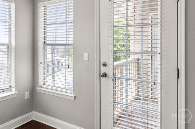 Walk out to the porch and storage closet. | Image 12
