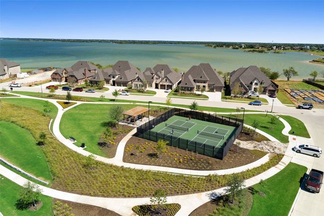 Channel your inner champion on the neighborhood pickleball courts! Two lighted courts encourage fun and exercise for both new and experienced pickleball players, without ever having to leave the community. | Image 38