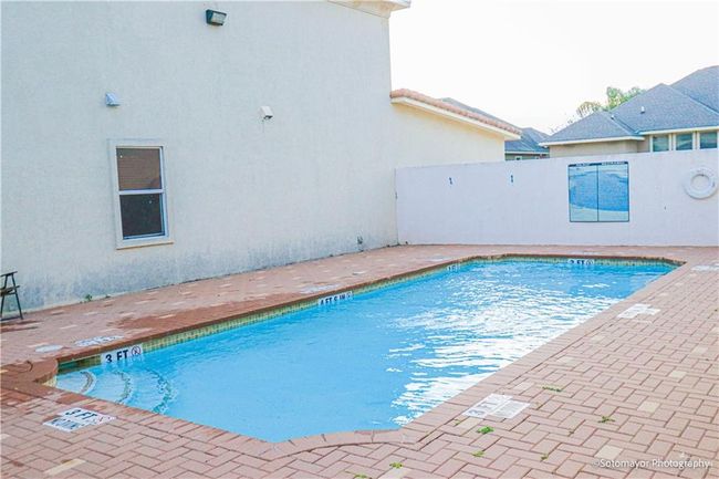 View of pool with a patio | Image 5