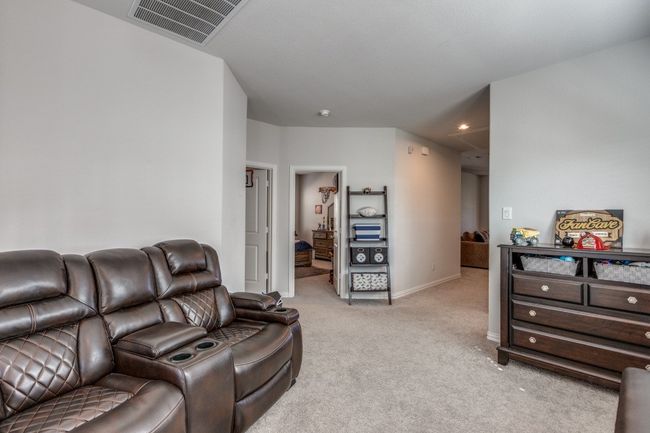 Living room with light carpet and baseboards | Image 15